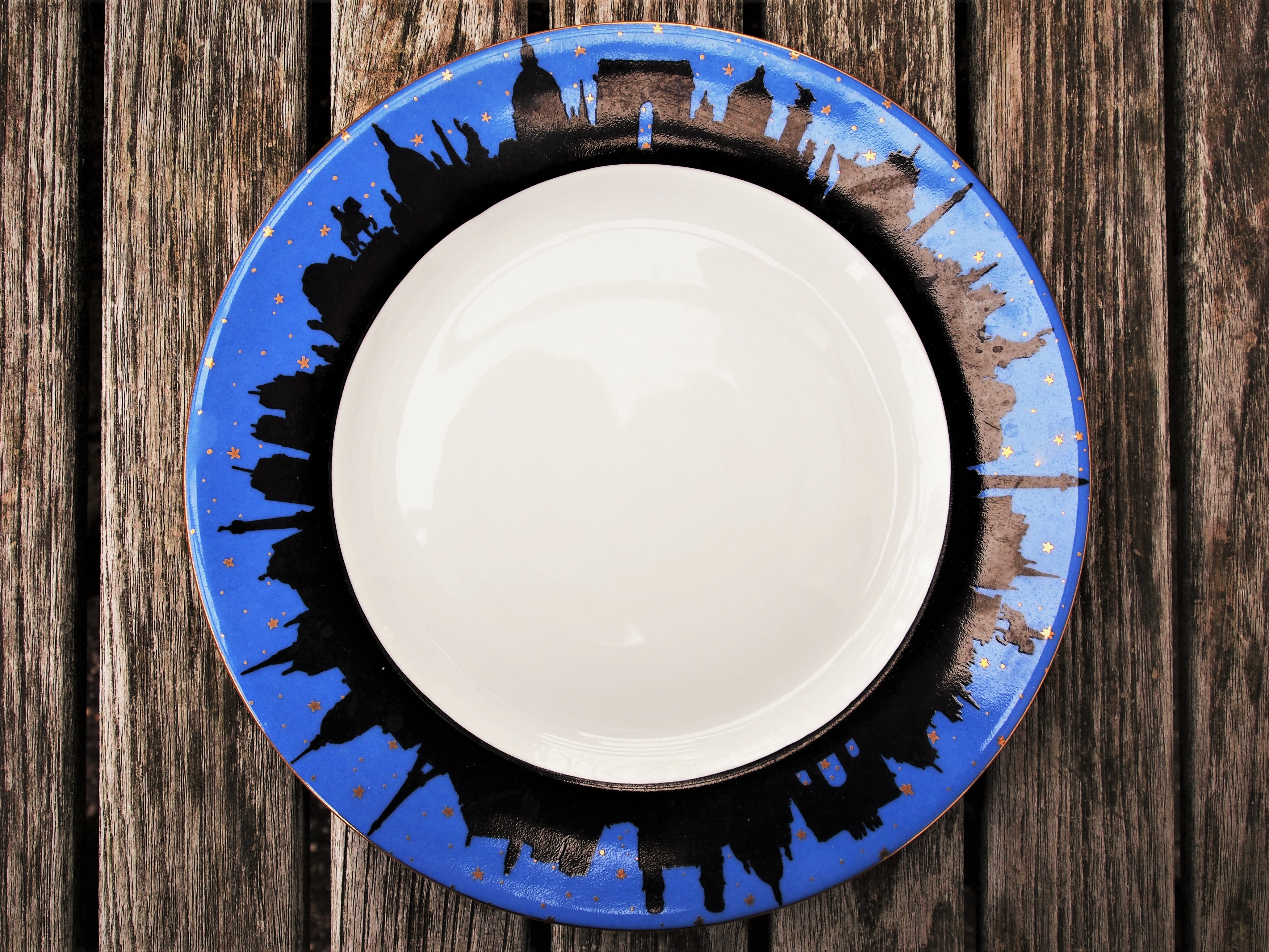 TABLETOP: PHILIPPE DESHOULIERES LIMOGES DESSERT/SALAD PLATES WITH THE PARIS SKYLINE AT NIGHT